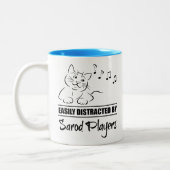 Neugierige Katze von Sarod Players leicht abgelenk Zweifarbige Tasse (Links)