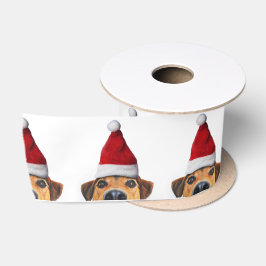 Neugieriger Niedlicher Hund mit Weihnachtsmannmütz Satinband