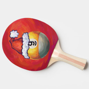 Neun Ball in Weihnachtsmannmütze über Rot Tischtennis Schläger