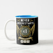 Never Underestimate The Power Of A Orr Zweifarbige Tasse (Links)