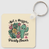 Nicht ein Hugger nur eine prickelnde Blume Niedlic Schlüsselanhänger (Rückseite)