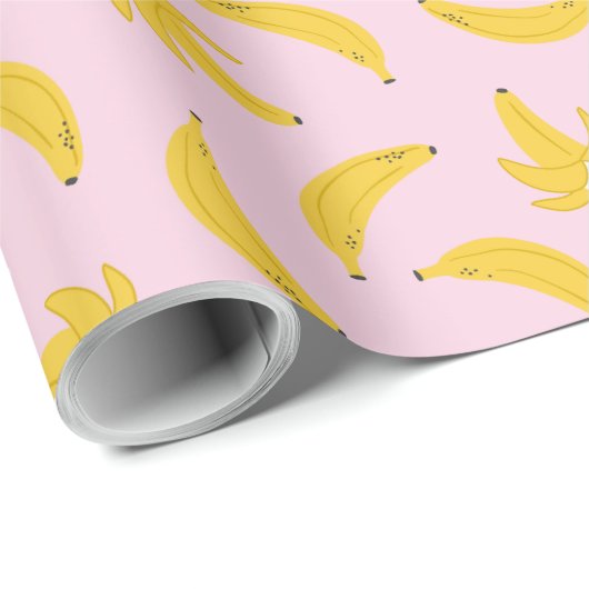 Niedliche Bananen in hellrosa Geschenkpapier (Rolleneckpunkt)