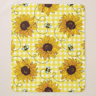 Niedliche Bienen und Sonnenblumen auf einem karier Sherpadecke