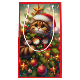 Niedliche, bösartige Katze im Weihnachtsbaum Kleine Geschenktüte