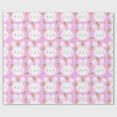 Niedliche Cartoonhäschen und -karotten auf rosa Geschenkpapier (Flach)