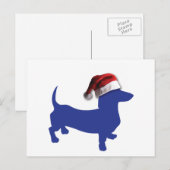 Niedliche Dackel in einer Weihnachtsmannmütze Feiertagspostkarte (Vorne/Hinten)