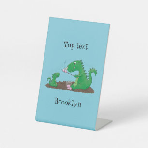 Niedliche Drachen braten Marshmallows Cartoon Sockelschild