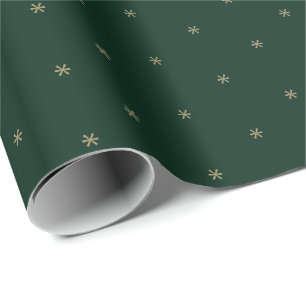 Niedliche dunkelgrüne Goldschneeflocken im Winter Geschenkpapier