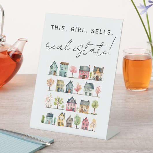 Niedliche farbenfrohe Häuser Dieses Mädchen verkau Sockelschild (In Situ)