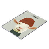 Niedliche, gemütliche Winterziege mit Beanie-Hut u Notizblock (Linke Seite)