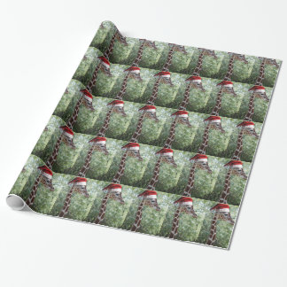 Niedliche Giraffe mit einem Weihnachtshut Geschenkpapier