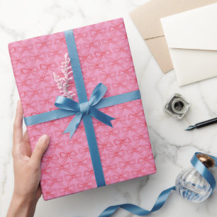 Niedliche Girl Doodle Rote Bows auf hellrosa Geschenkpapier