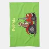 Niedliche glückliche Kuh, die einen roten Traktor- Geschirrtuch (Vertikal)