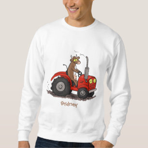 Niedliche glückliche Kuh, die einen roten Traktor- Sweatshirt
