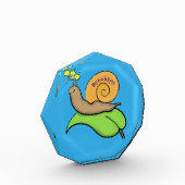 Niedliche, glückliche Schnecke auf einer Cartoon-I Fotoblock (Links)