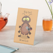 Niedliche Kakerlakenfigur Sockelschild (In SItu)