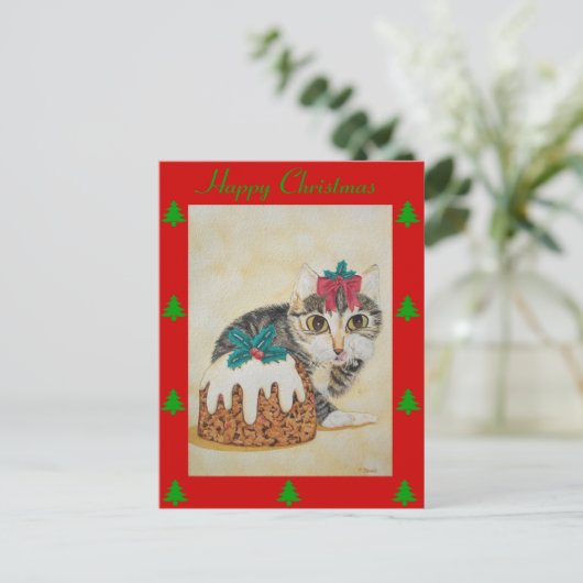 niedliche Kätzchen, die zu Weihnachten Pudding ess (Stehend Vorderseite)