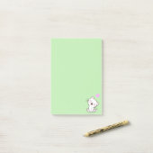 Niedliche Katze und Herz auf leicht grünen Post-it Klebezettel (Auf Schreibtisch)