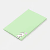 Niedliche Katze und Herz auf leicht grünen Post-it Klebezettel (angewinkelt)