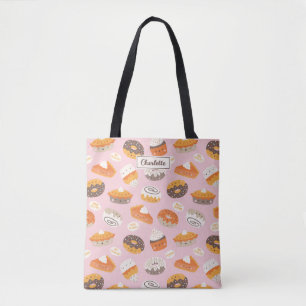 Niedliche Kuchen, Donuts und Kuchen auf hellrosa Tasche
