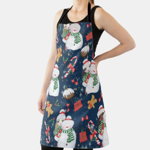 NIEDLICHE MÄDCHEN MIT WINTERSCHNEE UND KANDYKANEN SCHÜRZE