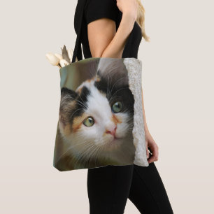 Niedliche, neugierige Katze Pneeaugen - auf Shoppe Tasche
