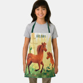 niedliche Pferdefreunde geben Kindern ihren Namen Schürze (Insitu)