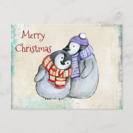 Niedliche Pinguine in Winterskarven und Weihnachte Feiertagspostkarte