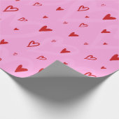 Niedliche Rinnherzen auf rosa Hintergrund Geschenkpapier (Ecke)