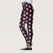 Niedliche rosa Blume auf schwarzen Leggings (Links)