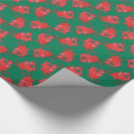 Niedliche rote Drachen auf dunklem grünem Umschlag Geschenkpapier (Ecke)