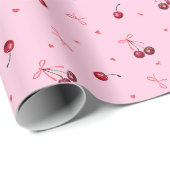 Niedliche rote Kirschen hören Bows auf rosa Geschenkpapier (Rolleneckpunkt)