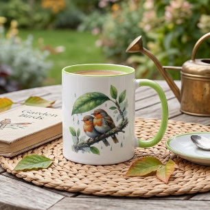 Niedliche Rotkehlchen unter einem Blattschirm Tasse