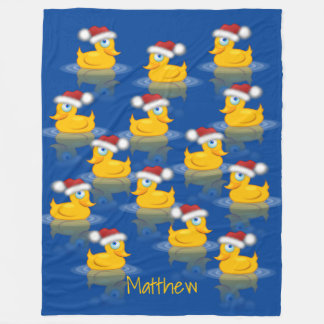 Niedliche Santa Rubber Enten im dunkelblauen Hinte Fleecedecke