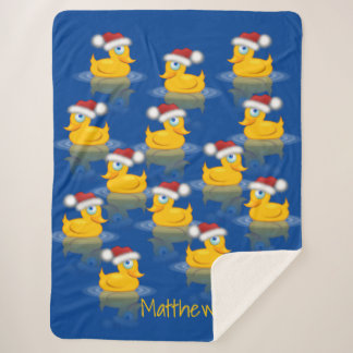 Niedliche Santa Rubber Enten im dunkelblauen Hinte Sherpadecke