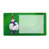 Niedliche Schafe in Weihnachtsmannmütze auf grün (Vorne)