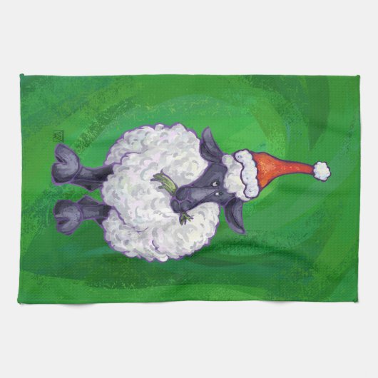 Niedliche Schafe in Weihnachtsmannmütze auf grün Küchentuch (Horizontal)