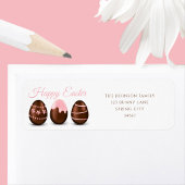 Niedliche Schokoladeneier glückliche Osteradresse