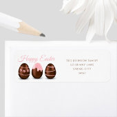 Niedliche Schokoladeneier glückliche Osteradresse