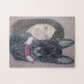 Niedliche schwarze Blinde akita kuscheln seinen be Puzzle (Horizontal)