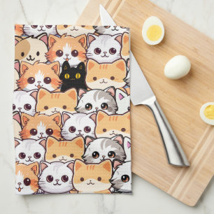 Niedliche schwarze Katze in orangefarbenen Katzen  Geschirrtuch