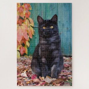 Niedliche schwarze Katze Kitten mit roten Blätter Puzzle