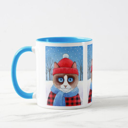 Niedliche Snowshoekatze, schneebedeckte Tasse (Links)