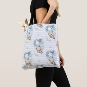 NIEDLICHE TEDDY-BÄREN, DIE AUF BLAUEN SCHLAFEN TASCHE