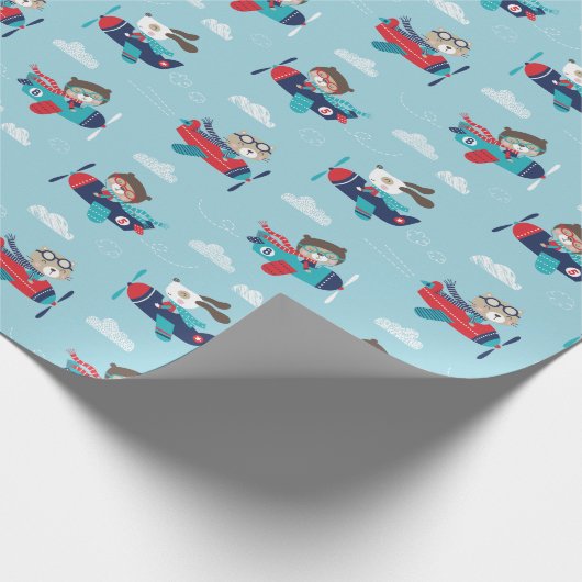 Niedliche Tiere in Flugzeugen auf blauem Wrapping Geschenkpapier (Ecke)