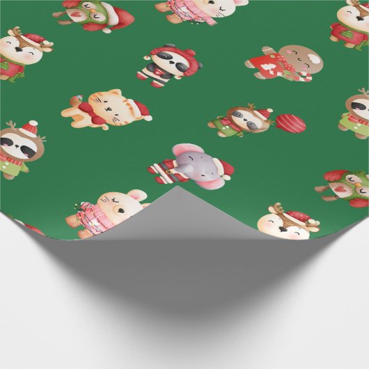 Niedliche und erfreuliche Weihnachtsbabys grün Geschenkpapier (Ecke)