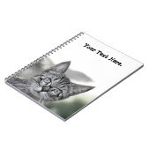 Niedliche und überraschende Katze mit GlasNotebook Notizblock (Linke Seite)