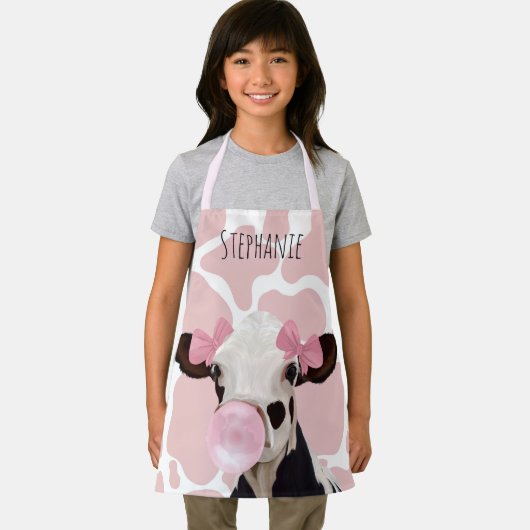 Niedliche weibliche Kuh mit rosa Kuh - Hintergrund Schürze (Insitu)