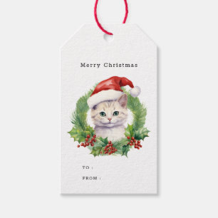 Niedliche Weihnachtskatze in einer Weihnachtsmannm Geschenkanhänger