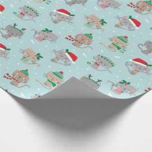 Niedliche Weihnachtskatzen auf hellblau Geschenkpapier
